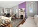 Bright living room features hardwood floors and a decorative fireplace with flatscreen TV at 3135 California St, Denver, CO 80205
