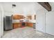 Bright kitchen with oak cabinets and modern appliances at 1231 S Yosemite Way # 71, Denver, CO 80247