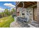 Exterior of a mountain home featuring a chairlift, stone accents, and lush green landscape at 242 Point View Pl, Breckenridge, CO 80424