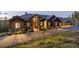 Inviting home featuring wood accents, stone details and a long driveway at 242 Point View Pl, Breckenridge, CO 80424