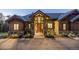Inviting home entrance featuring stone accents, wooden beams, and a grand door with sidelights at 242 Point View Pl, Breckenridge, CO 80424