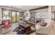 Open-concept living area with a ping pong table, Foosball table, sofa, and picturesque outdoor views at 242 Point View Pl, Breckenridge, CO 80424
