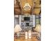 Inviting living room with stone fireplace, wood accents, and mountain view at 242 Point View Pl, Breckenridge, CO 80424