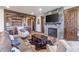 Inviting living room showcasing a stone fireplace, wet bar, and comfortable seating arrangements at 242 Point View Pl, Breckenridge, CO 80424