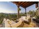 Outdoor patio with comfortable seating, a fire pit, and stunning mountain views at 242 Point View Pl, Breckenridge, CO 80424