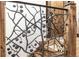 Artistic metal leaf staircase railing design at 242 Point View Pl, Breckenridge, CO 80424