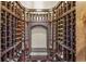 Elegant wine cellar featuring custom wood racks filled with an impressive array of wine bottles at 242 Point View Pl, Breckenridge, CO 80424