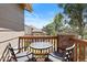 Balcony with seating, wooden deck, and a pleasant view of the outdoors at 22044 E Jamison Pl, Aurora, CO 80016