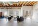 Unfinished basement with exposed ceiling, large windows, and sliding glass door to the outside at 22044 E Jamison Pl, Aurora, CO 80016