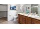 Bathroom with double vanity, walk-in shower, and modern fixtures at 22044 E Jamison Pl, Aurora, CO 80016