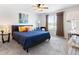 Comfortable bedroom with plush bed, ceiling fan, and ample natural light at 22044 E Jamison Pl, Aurora, CO 80016