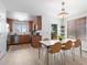 Bright dining area adjacent to the kitchen with stainless steel appliances and ample counter space at 22044 E Jamison Pl, Aurora, CO 80016