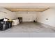 Spacious two-car garage with high ceilings provides ample space for parking and storage at 22044 E Jamison Pl, Aurora, CO 80016