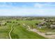 Beautiful aerial view of the neighborhood golf course, with lush greens and manicured fairways at 22044 E Jamison Pl, Aurora, CO 80016