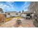 Backyard with patio, fire pit, and pergola at 1671 S Chase St, Lakewood, CO 80232