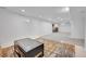 Finished basement with sitting area and carpet at 1671 S Chase St, Lakewood, CO 80232