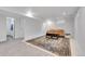 Finished basement with sitting area and carpet at 1671 S Chase St, Lakewood, CO 80232