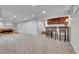 Finished basement with bar and seating area at 1671 S Chase St, Lakewood, CO 80232