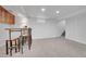 Finished basement with bar and seating area at 1671 S Chase St, Lakewood, CO 80232