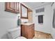 Basement bathroom with toilet, sink, and shower at 1671 S Chase St, Lakewood, CO 80232