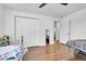 Cozy bedroom with twin bed and built-in shelving at 1671 S Chase St, Lakewood, CO 80232
