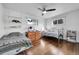 Charming bedroom with twin beds, dresser, and shelving at 1671 S Chase St, Lakewood, CO 80232