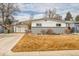 Ranch style home with attached garage at 1671 S Chase St, Lakewood, CO 80232