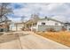 Ranch style home with attached garage and landscaping at 1671 S Chase St, Lakewood, CO 80232