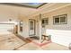 House front entry with covered carport at 1671 S Chase St, Lakewood, CO 80232