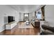 Living room with hardwood floors, comfortable seating and large windows at 1671 S Chase St, Lakewood, CO 80232