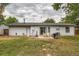 View of home with backyard patio, grill, and firepit at 3358 S Iris Ct, Lakewood, CO 80227