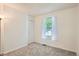 Bedroom featuring a window with natural light, a closet, and neutral paint at 3358 S Iris Ct, Lakewood, CO 80227