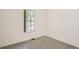 This room with carpet floors has a window, and baseboard trim at 3358 S Iris Ct, Lakewood, CO 80227