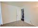 Neutral bedroom with carpet and view into another room at 3358 S Iris Ct, Lakewood, CO 80227