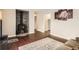 Inviting living room with hardwood floors and a wood burning stove at 3358 S Iris Ct, Lakewood, CO 80227