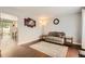 Inviting living room featuring stylish wood floors and natural light at 3358 S Iris Ct, Lakewood, CO 80227