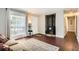 Warm living room with hardwood floors and a wood burning stove at 3358 S Iris Ct, Lakewood, CO 80227