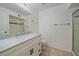 Bathroom with white vanity, marble countertop, and shower at 770 Copper Ln # 206, Louisville, CO 80027