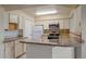 Well-equipped kitchen with granite counters and modern appliances at 770 Copper Ln # 206, Louisville, CO 80027