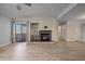 Living room with fireplace, hardwood floors, and balcony access at 770 Copper Ln # 206, Louisville, CO 80027