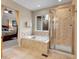 Bathroom featuring soaking tub and glass shower at 7138 Mountain Brush Cir, Highlands Ranch, CO 80130