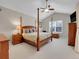 Main bedroom boasts a four-poster bed, wooden furniture, and a ceiling fan at 7138 Mountain Brush Cir, Highlands Ranch, CO 80130