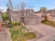 Charming home with a well-manicured lawn, mature tree and a three car garage at 7138 Mountain Brush Cir, Highlands Ranch, CO 80130