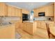 Gourmet kitchen featuring granite countertops, hardwood floors, ample cabinetry, and stainless steel appliances at 7138 Mountain Brush Cir, Highlands Ranch, CO 80130