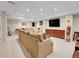 An expansive living room features plush seating, recessed lighting, and a built-in media center at 7138 Mountain Brush Cir, Highlands Ranch, CO 80130