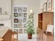 Living room with a fireplace and built-in shelving, wooden furniture, and a plant at 7138 Mountain Brush Cir, Highlands Ranch, CO 80130