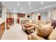 A comfortable living room features a sofa, a bar area with stools, and a coffee table at 7138 Mountain Brush Cir, Highlands Ranch, CO 80130