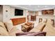 Comfortable basement living room with seating, bar, and television at 7138 Mountain Brush Cir, Highlands Ranch, CO 80130