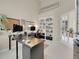 Bright office featuring vaulted ceilings, a built-in bookcase, a large desk, and plenty of natural light at 7138 Mountain Brush Cir, Highlands Ranch, CO 80130
