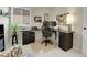 Functional office space with modern desk setup, dual monitors, and ample natural light at 7138 Mountain Brush Cir, Highlands Ranch, CO 80130